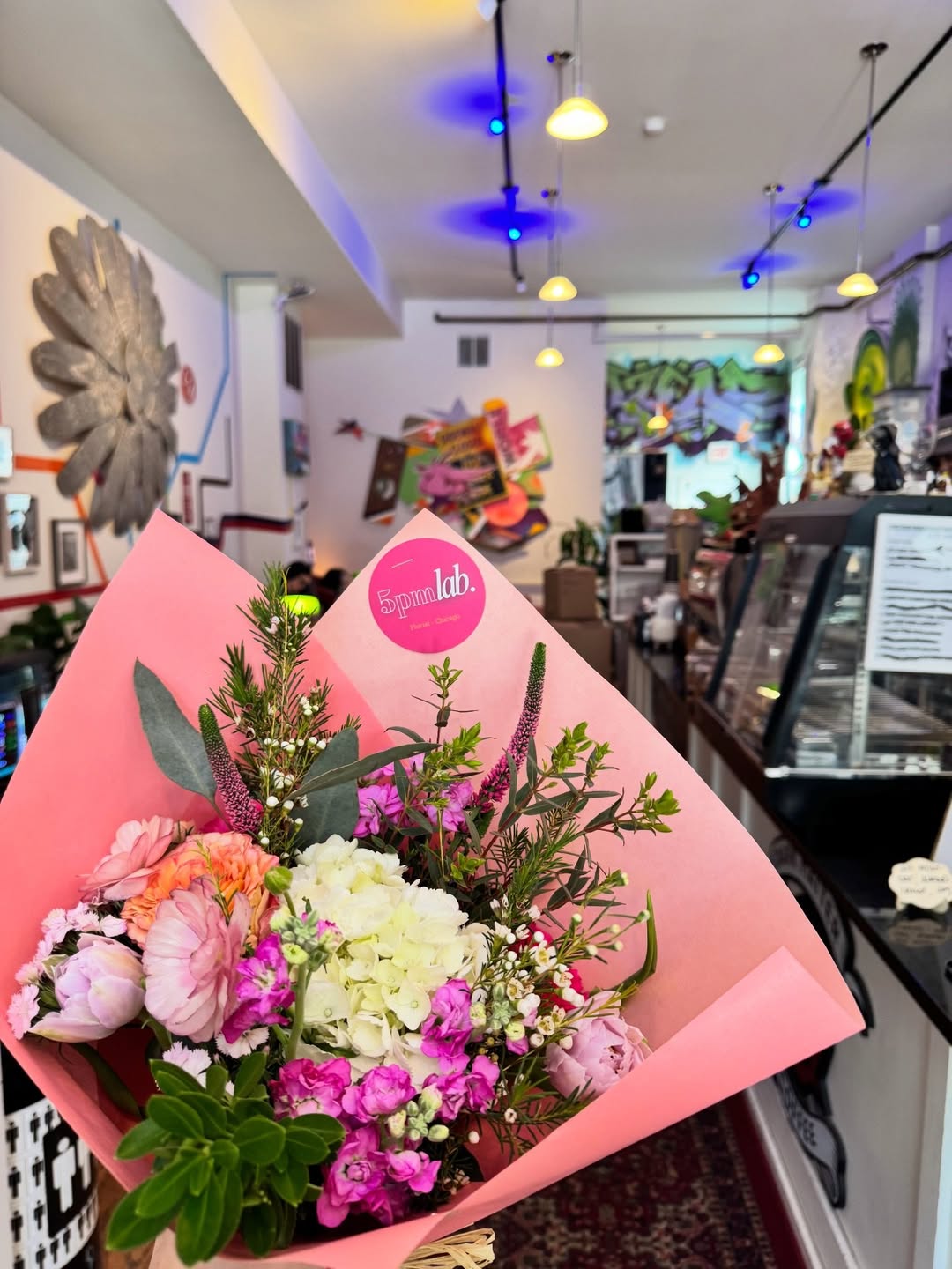 A wrapped bouquet ready to leave the shop